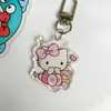 Llavero acrílico Sanrio colgante de pareja de dibujos animados serie Pacha dog llavero lindo colgante de mochila