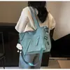 Bolso de hombro ligero, bolso de lona para commuting para mujer, nuevo bolso escolar de gran capacidad para estudiante universitario, bolso de mano al por mayor