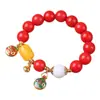 Pulsera de Raíz de Bodhi de Jade Rojo Especificaciones 1.2 con Colgante de Campana de Oro Arena Pulsera de Rosario para Hombres y Mujeres Venta al por Mayor