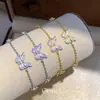 Pulsera de Mariposa de Colores Vibrantes con Circonita Fina Super Brillante y Aceite de Goteo Anillo de Mano Estilo Dulce Suave Sentido de Diseño de Nicho Joyería de Mano