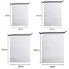 Las bolsas de plástico con cordón se pueden usar como empaques transparentes impermeables para llevar y bolsas de almacenamiento, se pueden imprimir con logotipos y son bolsas de PE a prueba de polvo