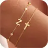 Amazon Transfronterizo Pulsera de 26 Letras con Forma de Cruz Estilo Nuevo Sencilla Versátil para el Viaje Diario Joyería de Moda Regalo para Mujeres