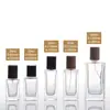 Botella de perfume de vidrio al por mayor de 30 ml, botella de muestra de aceite esencial cosmético de 50 ml con atomizador, tapa de haya, sub-botella de perfume por lote