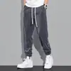 2023 nuevo caliente estilo Hong Kong otoño hombres todo partido sueltos tobillo atado pana suave marca de moda pantalones casuales hombres