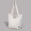 Bolsa Tote de Comércio Exterior Estilo Casual Simples para Mulheres 2025 Nova Textura Versátil Estudante Aula Grande Capacidade Bolsa de Ombro