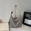 Bolsa de mano de gran capacidad estilo coreano para mujer, nuevo bolso de hombro versátil de moda, bolso cruzado de tela casual relajado para viajes