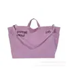 Bolsa de lona con estampado de letras para mujer, nuevo modelo 2026, gran capacidad, bolso de hombro simple y artístico, bolsa para el trabajo