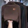Camisa Básica Escovada para Meninas Outono e Inverno 2025 Novo Suéter Infantil Gola Alta Meia Espessura Quente Tecido Térmico Dupla Face