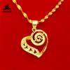 Venta al por mayor de colgantes de corazón en espiral de latón chapados en oro, joyería de imitación de oro, venta directa de fábrica, mercado nocturno.