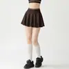 Conjunto deportivo de falda de tenis con borde de color blocking con copas fijas en el pecho camiseta sin mangas de espalda cruzada falda corta anti-exposición conjunto de dos piezas fitness yoga