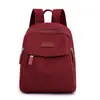 Mochila de mujer bolsa de tela de nailon nueva moda simple mochila escolar mini para damas ocio viaje mochila pequeña venta al por mayor
