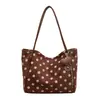 Bolso de un solo hombro nicho retro lunares gran capacidad bolso de mano transfronterizo nuevo estilo perezoso bolsa de mano para el día a día al por mayor