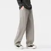 Pantalones de chándal con diseño patchwork para hombre, estilo otoño e invierno, color liso, corte recto, ajuste holgado, cintura elástica, pantalones deportivos casuales modernos y versátiles