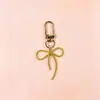 Llavero de lazo de cuentas estilo INS de colores con cinta, colgante de aleación, accesorio para niñas, charm para mochila, accesorio de hebilla para puerta