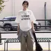 Camiseta Blanca de Puro Algodón de Manga Corta para Mujer, Nuevo Diseño Verano 2026, Estilo Nicho, Hombro Normal, Top Holgado y Casual de Media Manga