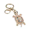 Accesorio decorativo de tortuga con pedrería de alta venta, llavero de aleación incrustado con diamantes, charm para bolso de mujer, accesorio colgante para coche