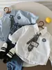 Camisas para Niños 2026 Otoño Nuevo Estampado Digital Dibujos Animados Camisas Personalizadas Bebé Estilo Coreano Versátil Camisas de Algodón de Color Sólido