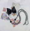 Clip trasero para teléfono móvil correa cruzada para niñas clip de cordón con lazo clip trasero japonés y coreano cordón transparente de dibujos animados para teléfono móvil