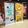 Soporte de exhibición tipo puerta de hierro engrosado 80x180, soporte de exhibición tipo puerta para publicidad exterior, fabricante mayorista de banners enrollables rellenos de agua