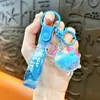 Llavero creativo de concha pequeña con aceite, lindo colgante pequeño de arena movediza líquida, accesorios para bolso, pequeño colgante de regalo, venta al por mayor