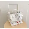 Bolso de cubo tejido de nicho transfronterizo 2026 nuevo bolso de cesta de moda para mujer bolso de mano simple para hombro cruzado