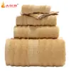 Huohongxiang toalla toalla de fibra de bambú ondulada toalla de baño juego de tres piezas liso toalla de regalo venta al por mayor