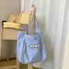 Bolsa Tote Casual para Mulheres 2026 Verão Nova Bolsa de Compras de Grande Capacidade Estilo Coreano Bolsa de Ombro para Estudantes Bolsa de Mão Versátil