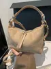 Bolso de axila liso de estilo retro muy elegante, nuevo modelo principios de otoño 2026, único y moderno, adecuado para el trabajo y los desplazamientos, bolso de hombro y cruzado