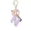 Venta Caliente Transfronteriza Az Letra de Resina Inglesa Llavero Colgante de Borla de Mariposa Morada Colgante para Bolso de Mujer