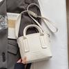 Explosiones de Primavera y Verano Color Sólido Simple Alta Calidad Patrón Lichi Bolso Cubo Portátil Moda Femenina Combinable Bolso Cruzado para Viaje