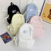 Mochila de nailon de color liso de alta moda 2026, bolsa de secundaria moderna y ligera con gran capacidad