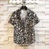 2025 Transfronteriza Nueva Camisa Casual de Manga Corta Floral para Hombre Marca de Tendencia Moda Multicolor Estilo Playa Camisa Casual para Hombre