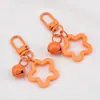 Llavero con Colgante de Campana de Estrella de Cinco Puntas de Colores Caramelo de Aleación Cubierta para Auriculares Decoración de Pareja
