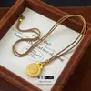 Estilo Tienda de Oro Lujo Ligero Colgante de Bolsa de Dinero de la Suerte Giratorio de Diamante para Mujeres Nuevo Colgante de Bolsa de Dinero Giratorio Incrustado de Diamantes