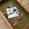 Collar Colorido de Corazón de Saturno para Mujer 2025 Nuevo Diseño de Nicho Cadena Larga para Clavícula Dulce y Fresco Elegante Accesorios Versátiles
