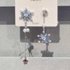 "La primera nieve" aretes simples retro de otoño e invierno azul blanco piedra copo de nieve borla alto sentido del temperamento nicho aretes versátiles