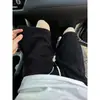 Pantalones cortos de punto estilo Chanel en blanco y negro para hombre, pantalones nuevos de verano de longitud media con un toque de alta gama, shorts deportivos casuales holgados