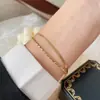 Pulseira de osso de cobra de camada dupla transfronteiriça japonesa e coreana feminina simples versátil pulseira de ouro 18K joia de nicho de alta qualidade que não desbota