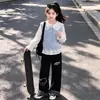 Conjunto casual versátil de moda para niñas estilo coreano, camisa chaleco dopamina otoño 2026, conjunto de capas