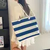 2026 Nueva Bolsa de Lona Casual de Gran Capacidad Versátil para el Trabajo y los Viajes Diarios Bolso de Hombro Ligero con Rayas para Mujer