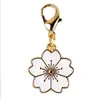 Venta Caliente Transfronteriza Aleación Esmalte Flor de Cerezo Colgante Broche Universal DIY Ropa Llavero Bolso Collar Pendientes Accesorios