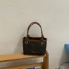 Bolso pequeño súper popular para mujer, nuevo y moderno bolso de cubo de verano para el trabajo, de hombro y cruzado