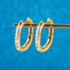 Clip para oreja de círculo personalizado transfronterizo europeo y americano de oro rosa con circonita, clip para oreja de moda de nicho con siete diamantes, arete de acero inoxidable al por mayor