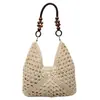 Bolso de mano de paja tejida de moda para mujer, nuevo estilo de verano 2026, bolso de hombro con bloques de color, bolso casual para el antebrazo