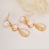 Joyería al por mayor de Zhuji Aretes de perlas de agua dulce Aretes Aguja de plata s925 Aretes de nácar Sentido avanzado para enviar a novias