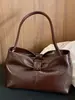 2026 Nuevo Bolso de Mano con Cadena y Lazo Transfronterizo Bolso de Hombro Simple para el Trabajo Bolso Cruzado Personalizado Bolso de Axila para Mujer