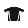 Moda casual para uso diario, estilo retro deportivo primavera/verano, camisa polo de manga corta con retazos en blanco y negro, mangas raglán acanaladas y corte holgado