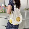 Bolsa de palha trançada versátil e despojada com rosto sorridente, nova tendência ins de crochê vazado de verão, grande capacidade, bolsa de ombro única, moda feminina 2026