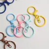 Accesorios para joyería DIY pintura de colores aleación de zinc redondo pequeño llavero de dragón cierre de langosta juego de 3 piezas hebilla colgante de juguete de 8 caracteres