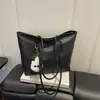 Bolso de mujer 2026 nuevo modelo primavera-verano, bolso tote simple de hombro, bolso de hombro de nicho de alta gama, comercio exterior